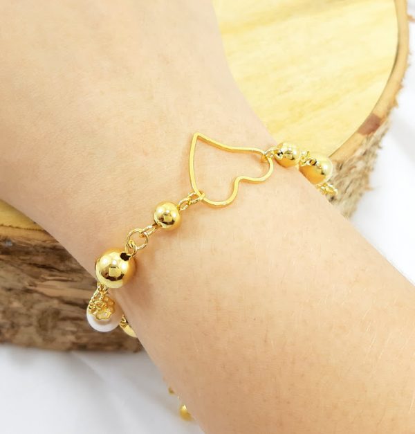 Pulseira com pérola e bolas liso dourado