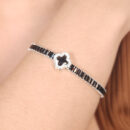 Pulseira trevo preto com borda cravejada