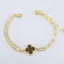 Pulseira corrente cartier e riviera baguete com trevo detalhado