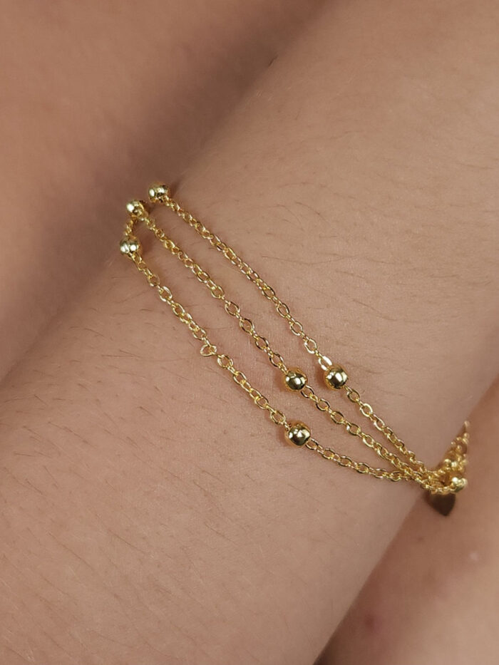 Pulseira tripla com bolinhas douradas