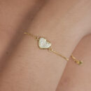 Pulseira coração cravejado borda dourada