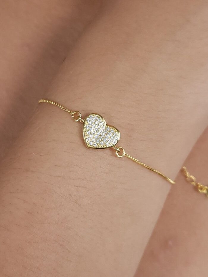 Pulseira coração cravejado borda dourada