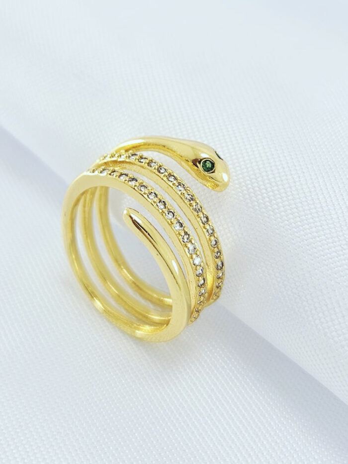 Anel três fios cravejado cobra olho verde