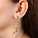 Brinco base cristal elo torcido pêndulo