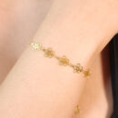Pulseira flores vazado dourado
