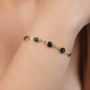 Pulseira pedras pretas detalhe dourado