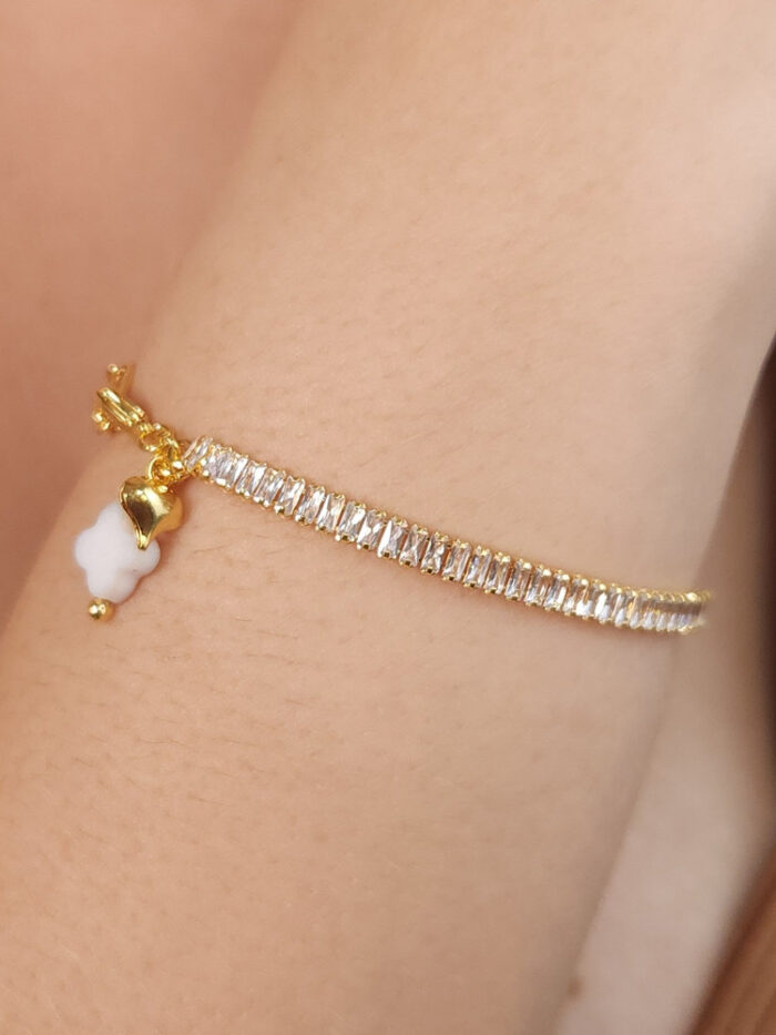 Pulseira pedra baguete e elo cartier com trevo branco