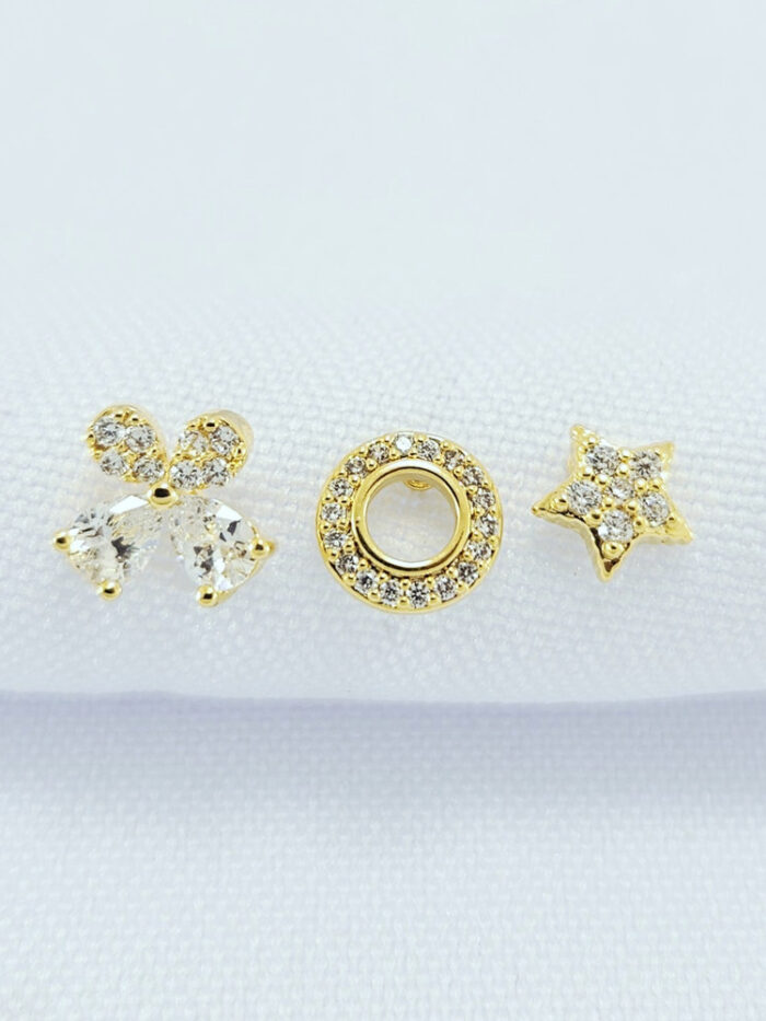 Trio de brincos estrela com circulo e flor cravejado