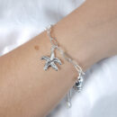 Pulseira elo cartier com concha e estrela-do-mar