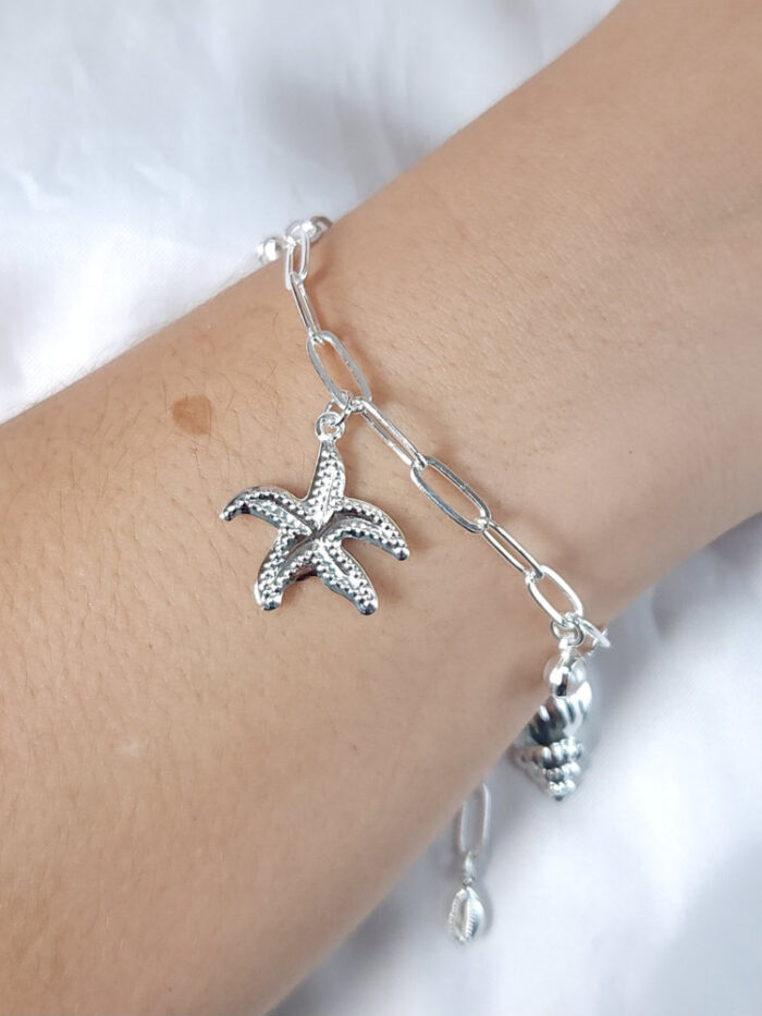 Pulseira elo cartier com concha e estrela-do-mar