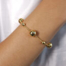 Pulseira com bola dourada