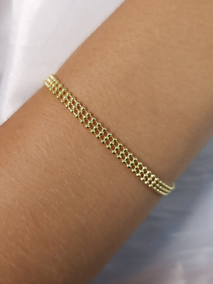Pulseira fios triplo bolinhas dourada