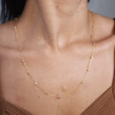 Gargantilha longuinho com bolas douradas