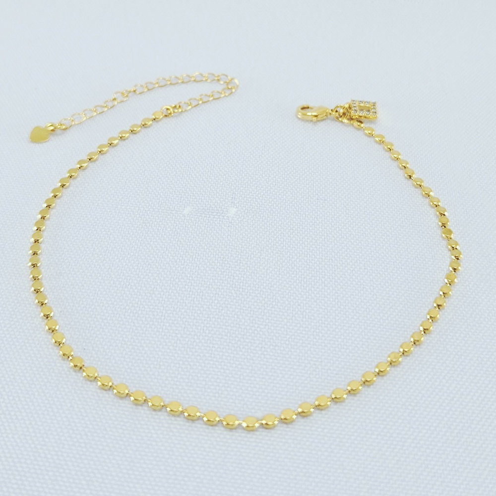 Tornozeleira com bolinhas achadatas