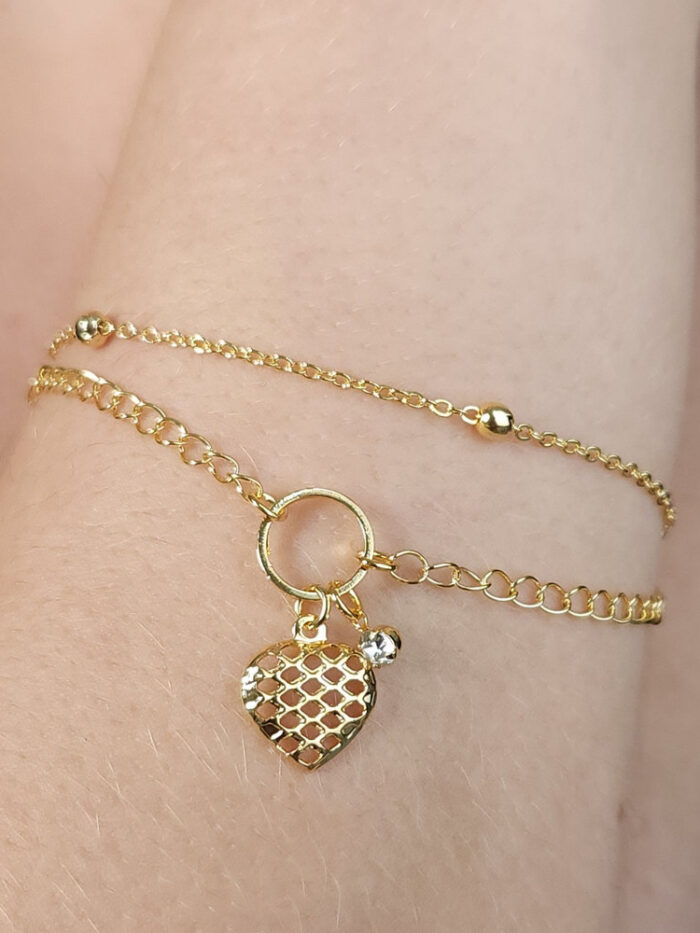 Pulseira dupla com pêndulo coração vazado e ponto de luz