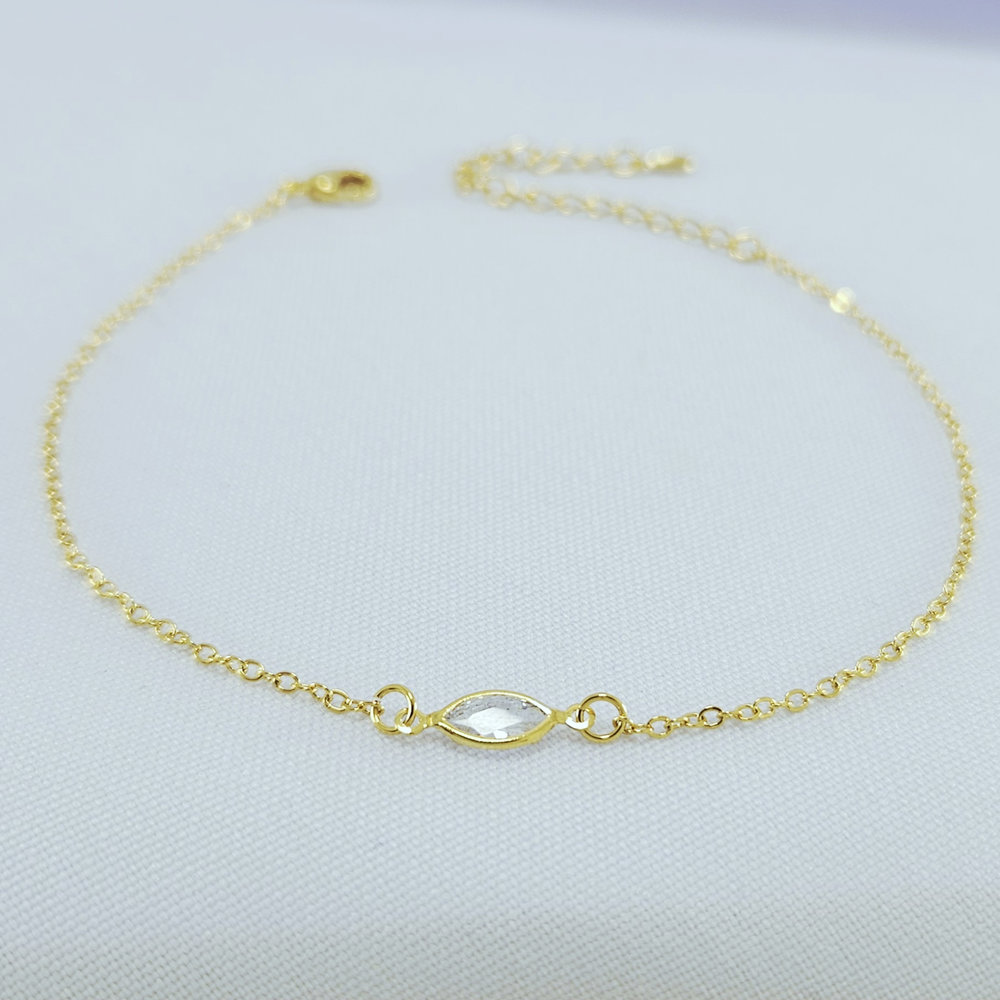 Tornozeleira modelo com pedra navete cristal