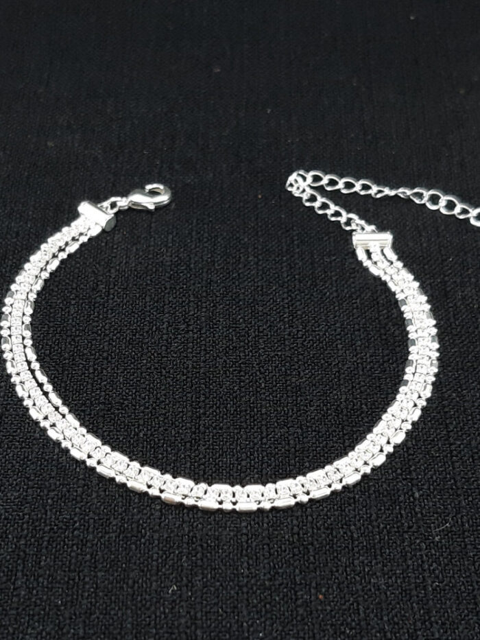 Pulseira tripla gomos laminados com fio riviera