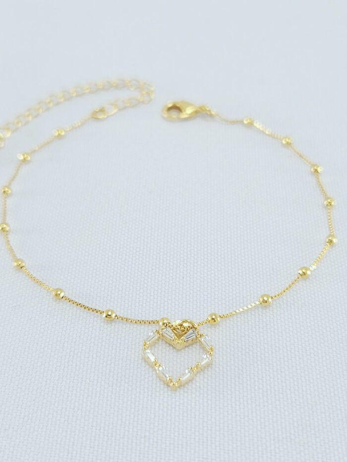 Pulseira detalhe bolinhas e coração pêndulo