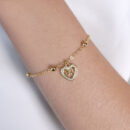 Pulseira coração cravejado detalhe laço