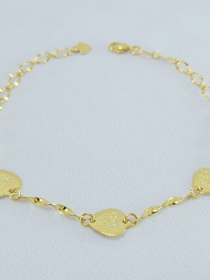 Pulseira elos torcido coração detalhados