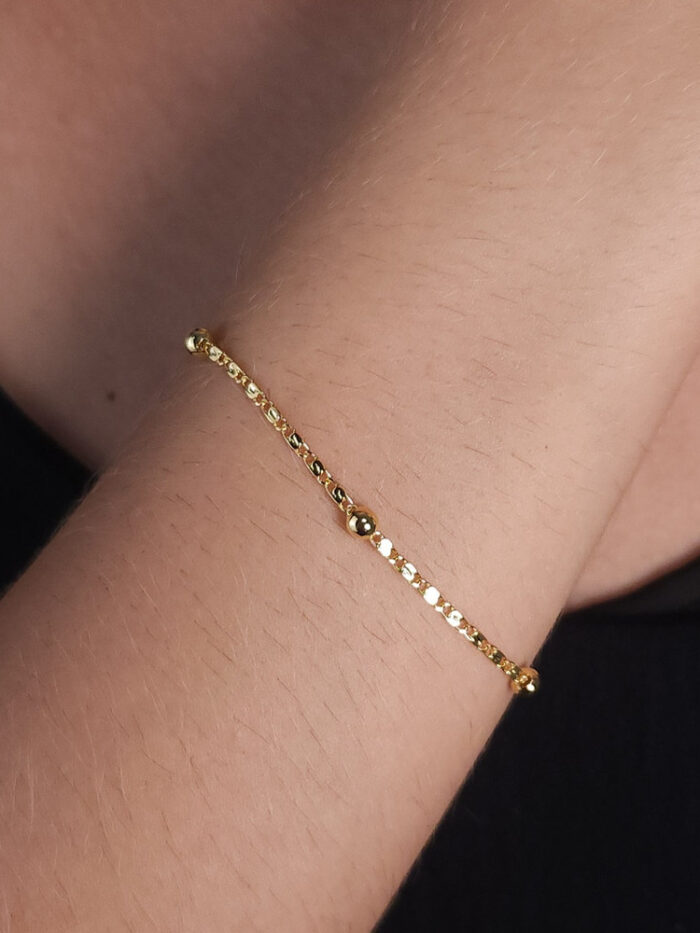 Pulseira elo pisatrine com bolinha dourada