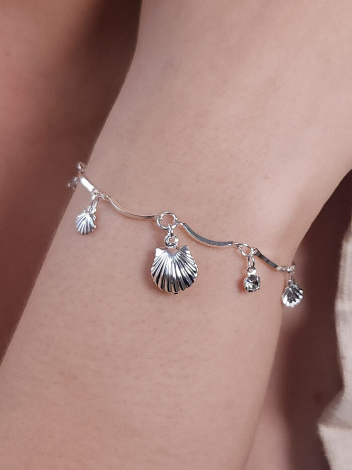 Pulseira caninho curvado concha com cristal