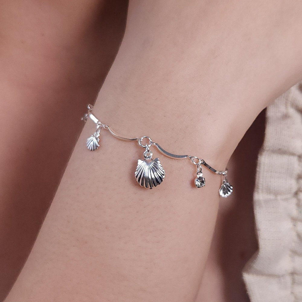 Pulseira caninho curvado concha com cristal