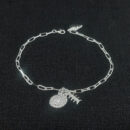 Pulseira cartier com concha espiral e esqueleto de peixe