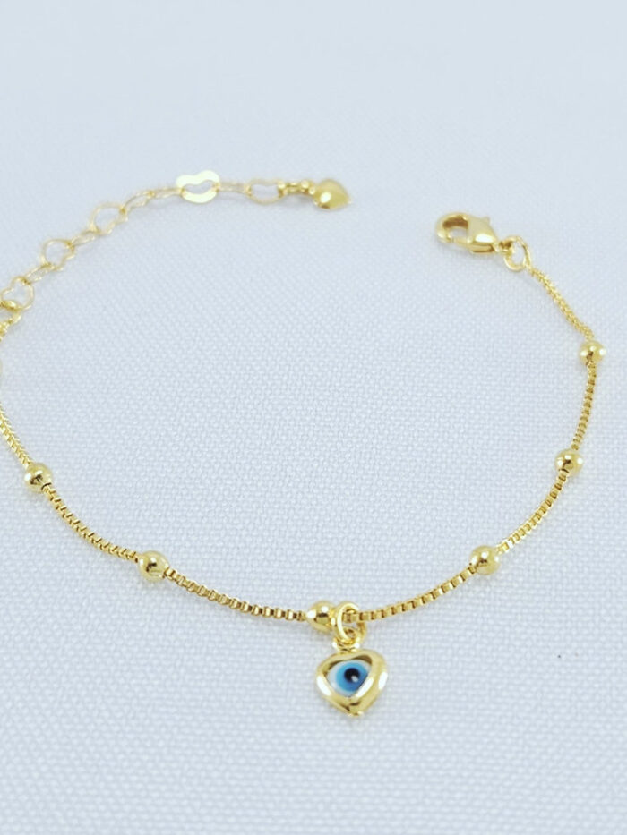 Tornozeleira bolinhas dourada com olho grego