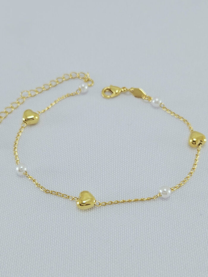 Pulseira pérola com corações lisos