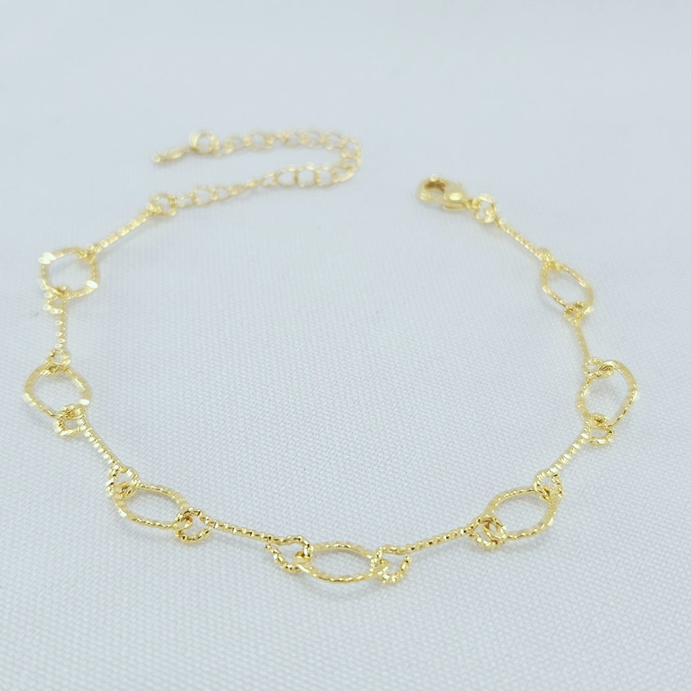 Pulseira elos ovais e caninho detalhado